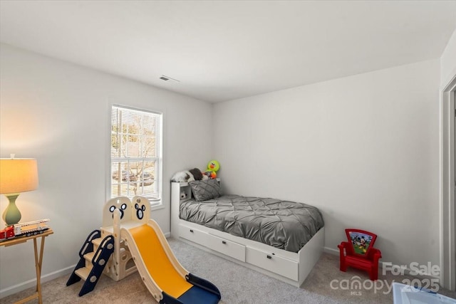 bedroom featuring visible vents, baseboards, and carpet flooring