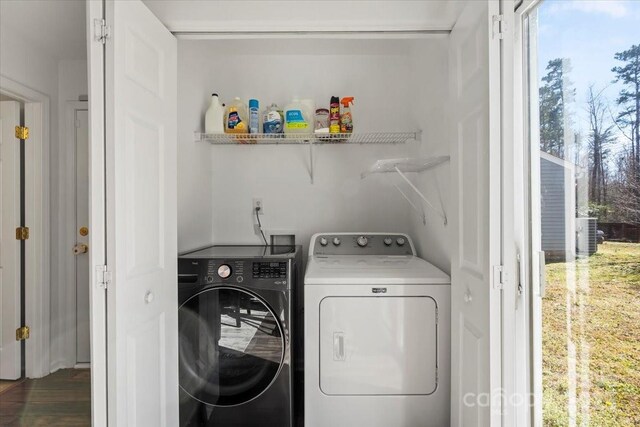 clothes washing area featuring laundry area and independent washer and dryer