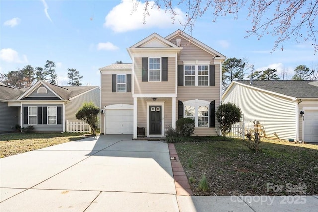 traditional-style house featuring driveway and an attached garage