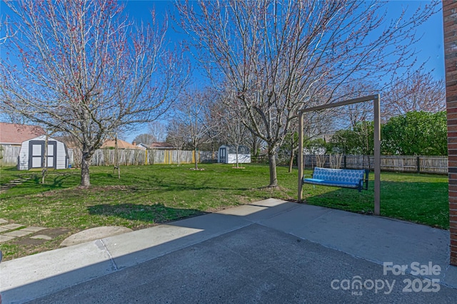 exterior space with an outbuilding, a fenced backyard, and a shed