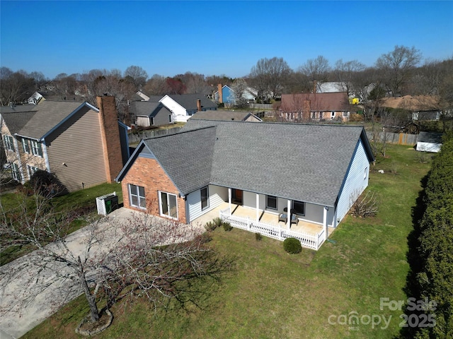 birds eye view of property with a residential view