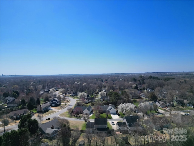 birds eye view of property with a residential view