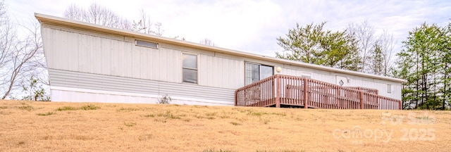 back of property featuring a deck