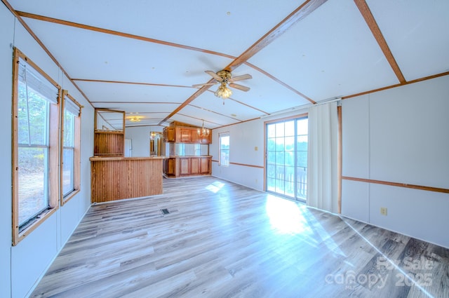 unfurnished living room with light wood-style floors, vaulted ceiling with beams, and a ceiling fan