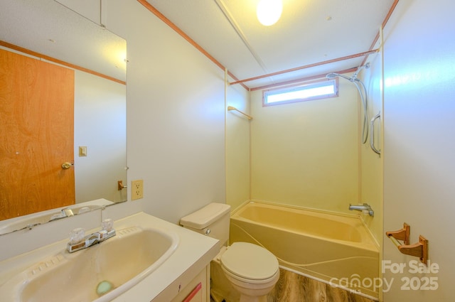 full bathroom featuring shower / tub combination, vanity, toilet, and wood finished floors