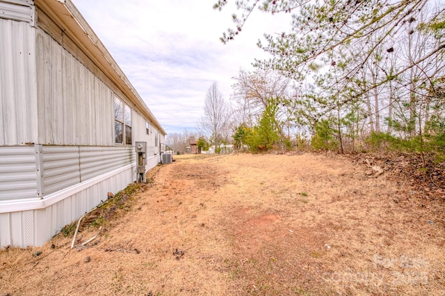 view of yard featuring central AC