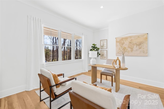 home office featuring light wood finished floors, baseboards, and recessed lighting