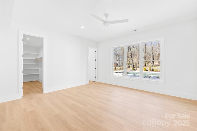 spare room with recessed lighting, baseboards, ceiling fan, and light wood finished floors