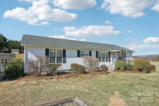 single story home with a front lawn