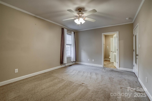 empty room featuring ceiling fan, baseboards, crown molding, and light colored carpet