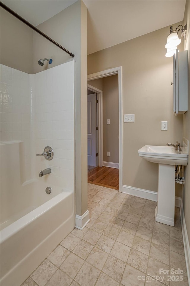 bathroom with  shower combination and baseboards