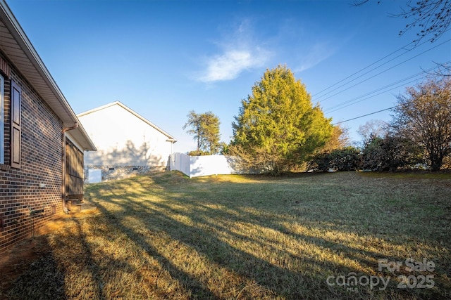 view of yard with fence