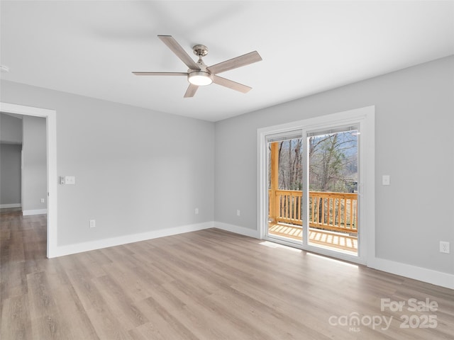 empty room featuring light wood-style flooring, baseboards, and ceiling fan