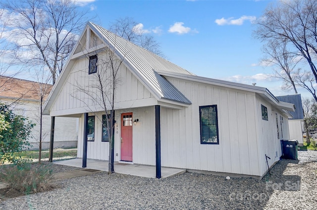 modern farmhouse style home featuring metal roof