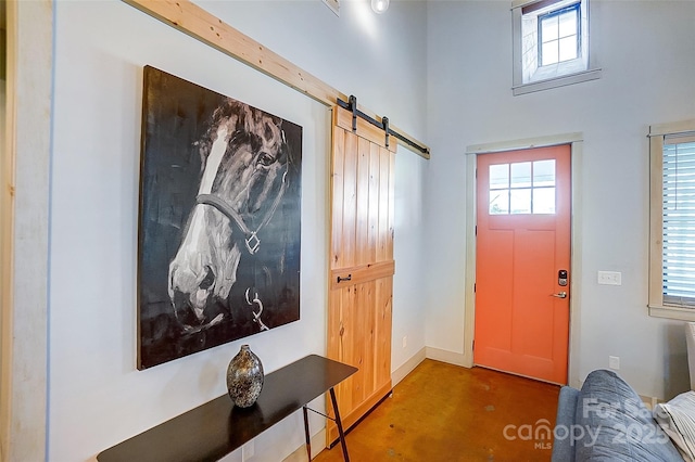 foyer entrance featuring a barn door