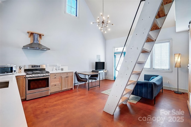 kitchen featuring stainless steel appliances, light countertops, concrete flooring, and high vaulted ceiling