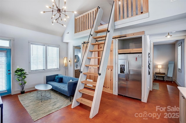 living room featuring high vaulted ceiling, a notable chandelier, visible vents, stairs, and finished concrete floors