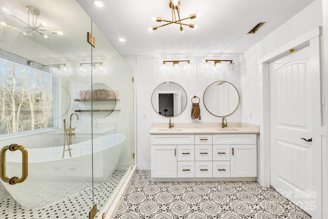 full bath featuring a soaking tub, a sink, a shower stall, and double vanity