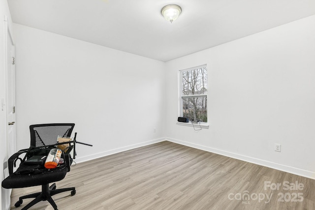 office with wood finished floors and baseboards