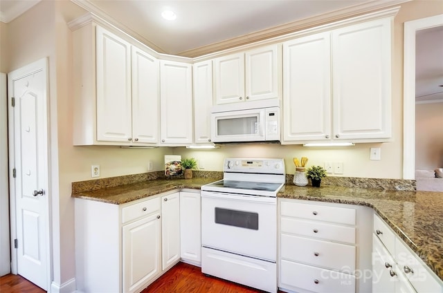 kitchen with white appliances, dark wood-style flooring, white cabinets, and dark stone countertops