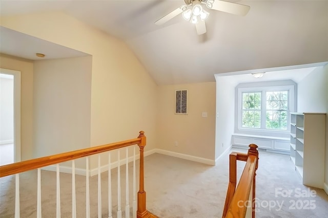 bonus room with light carpet, visible vents, baseboards, a ceiling fan, and vaulted ceiling