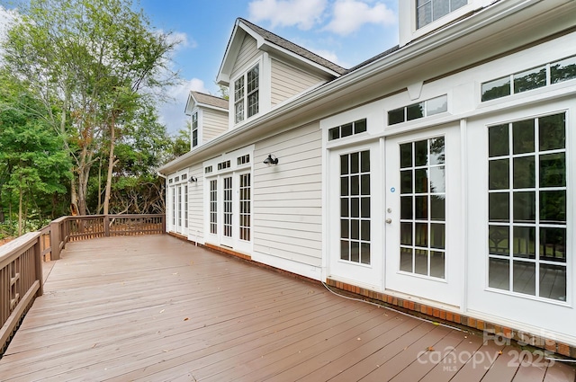 wooden deck featuring french doors