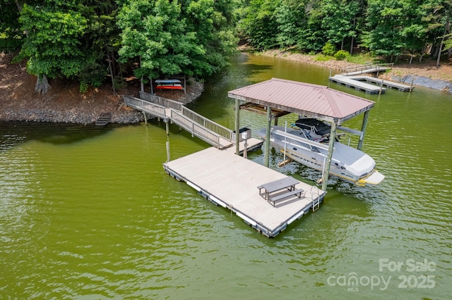 view of dock with a water view and boat lift