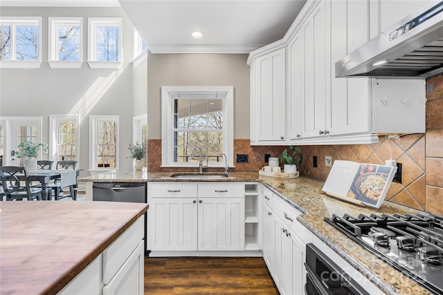 kitchen featuring a sink, gas cooktop, stainless steel dishwasher, ventilation hood, and wall oven