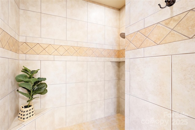 full bath with tiled shower