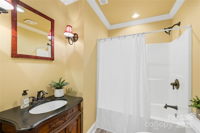 full bath with vanity, crown molding, visible vents, and shower / bath combo