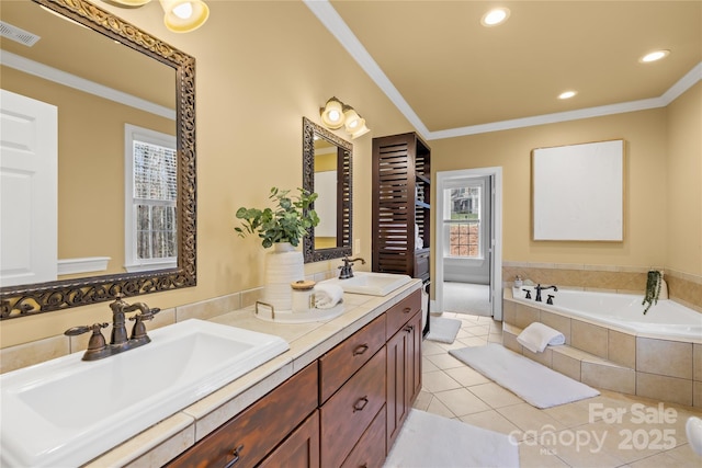 228 Wildwood Cove Dr, Mooresville, NC 28117 - bathroom featuring healthy amount of natural light, double vanity, crown molding, a bath, and recessed lighting