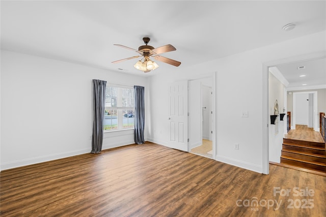 228 Wildwood Cove Dr, Mooresville, NC 28117 - unfurnished bedroom featuring wood finished floors and ceiling fan