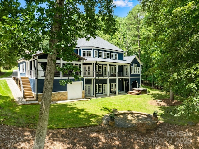 228 Wildwood Cove Dr, Mooresville, NC 28117 - rear view of property featuring french doors, a yard, stone siding, a deck, and stairs