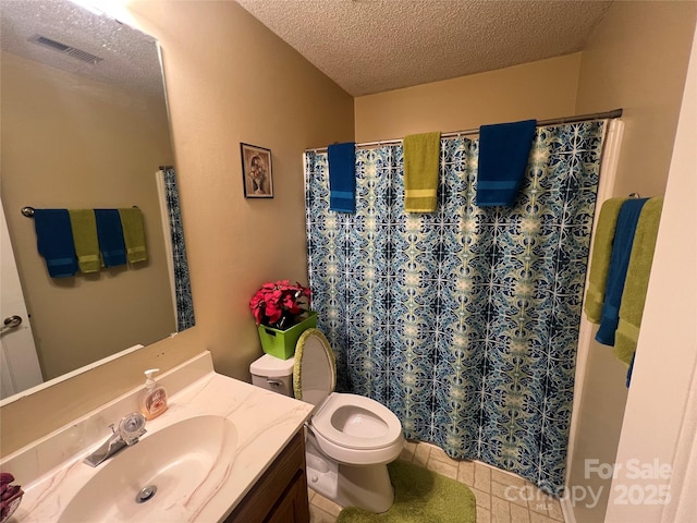 bathroom with visible vents, toilet, tile patterned flooring, a textured ceiling, and vanity