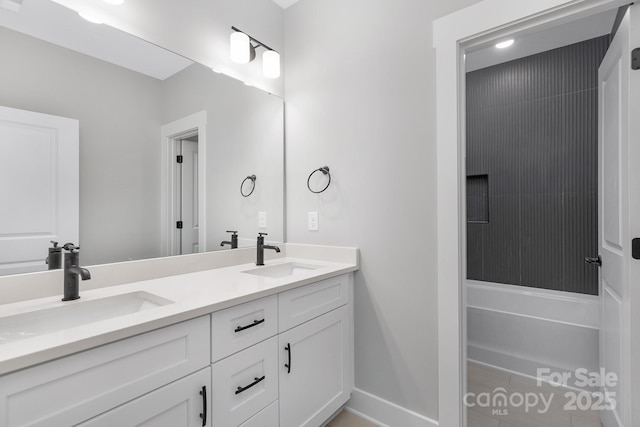 bathroom featuring double vanity and a sink