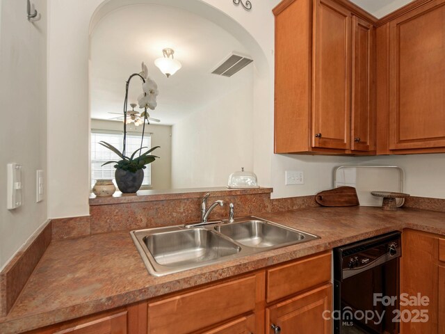 kitchen featuring visible vents, brown cabinets, black dishwasher, and a sink