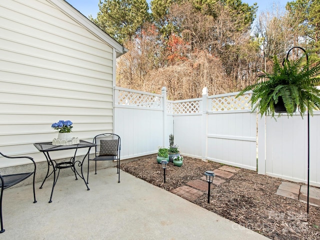 view of patio / terrace with outdoor dining space and fence