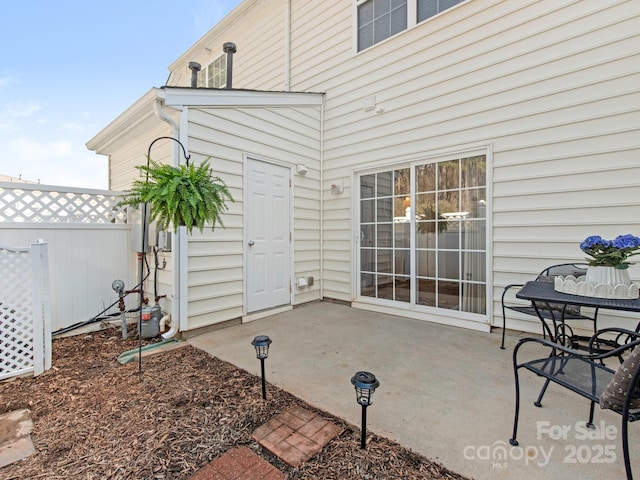 view of patio / terrace featuring fence