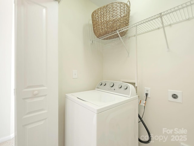 clothes washing area with laundry area and washer / clothes dryer