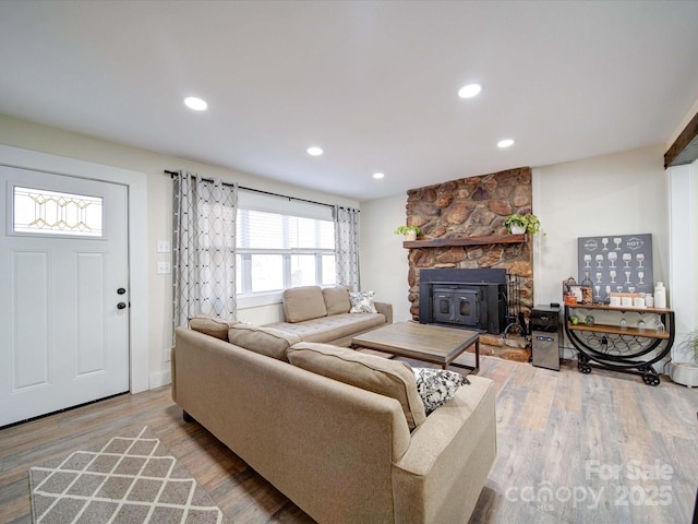 living room featuring recessed lighting and wood finished floors