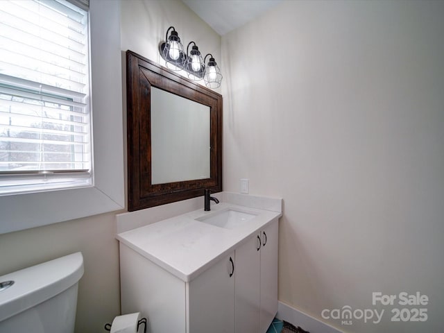 bathroom with vanity and toilet