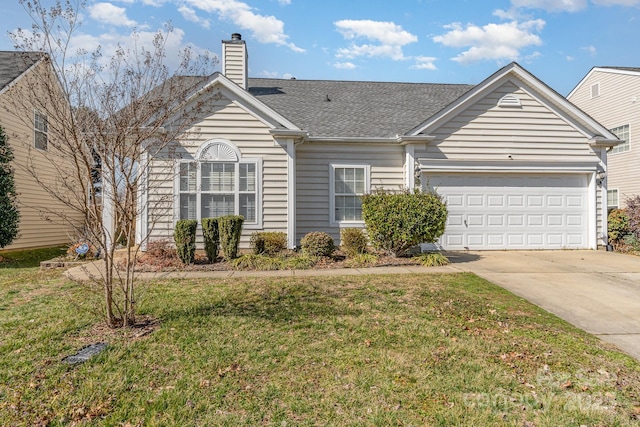 ranch-style home featuring an attached garage, driveway, a chimney, and a front lawn