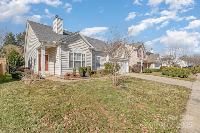 view of front facade featuring a garage, driveway, a chimney, and a front yard