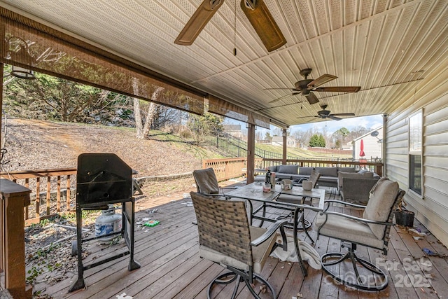 deck featuring ceiling fan, outdoor lounge area, and outdoor dining space