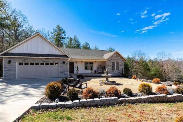 ranch-style house featuring board and batten siding, concrete driveway, a shingled roof, and an attached garage