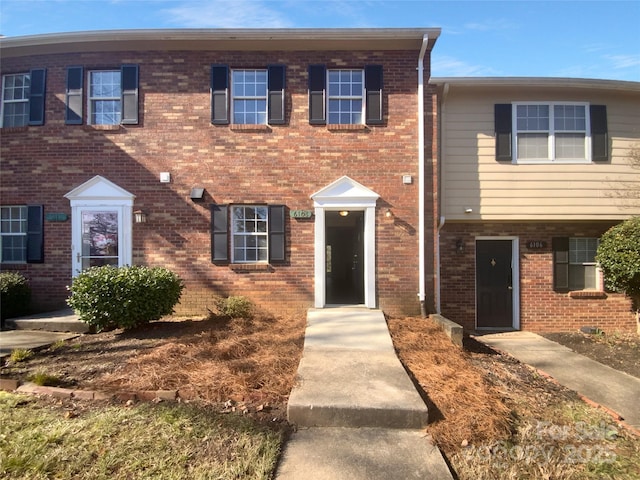 view of front of house with brick siding