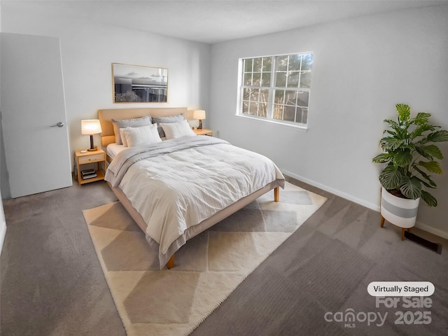 bedroom with carpet and baseboards