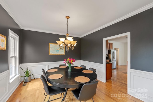 1919 46th Avenue Dr NE Unit 46, Hickory, NC 28601 - dining area with a chandelier, wainscoting, light wood-style floors, crown molding, and a decorative wall