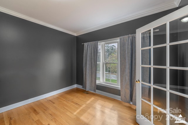 1919 46th Avenue Dr NE Unit 46, Hickory, NC 28601 - empty room featuring baseboards, healthy amount of natural light, ornamental molding, and wood finished floors