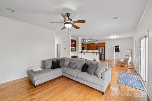 1919 46th Avenue Dr NE Unit 46, Hickory, NC 28601 - living room featuring ornamental molding, a ceiling fan, light wood-style flooring, and baseboards